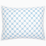 A Layla Azure Quilt pillow by John Robshaw with a blue and white geometric pattern.