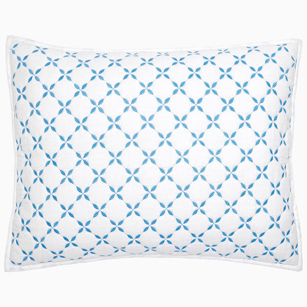 A Layla Azure Quilt pillow by John Robshaw with a blue and white geometric pattern.