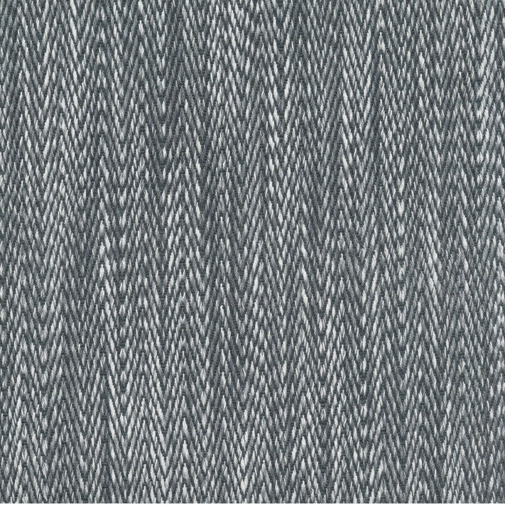 A Tapasa Gray Fabric rug with a zig zag pattern by John Robshaw.