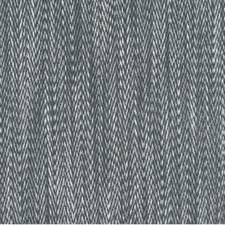 A Tapasa Gray Fabric rug with a zig zag pattern by John Robshaw.