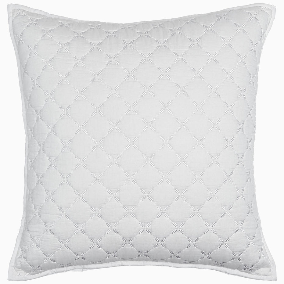 A Layla White Quilt pillow on a white background, made from cotton voile. (Brand: John Robshaw)