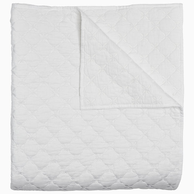 A Layla White Quilt by John Robshaw on a white background.