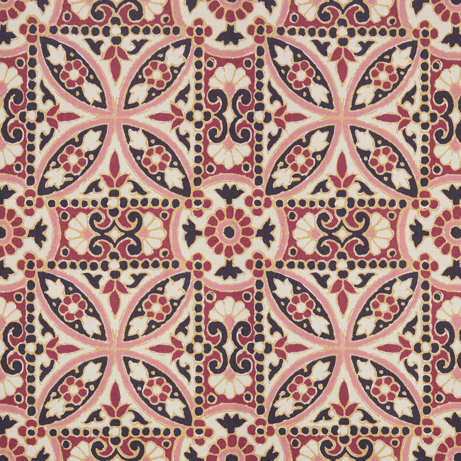 A pink and black Oman Berry Fabric tile with a floral design, featuring a block print pattern by John Robshaw.