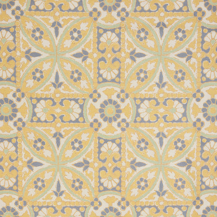 A John Robshaw Oman Marigold Fabric rug with an ornate design in yellow and blue.