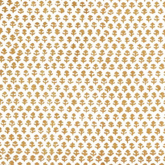 A Bindi Gold Fabric with a gold and white pattern on traditional hand block printed fabrics by John Robshaw.