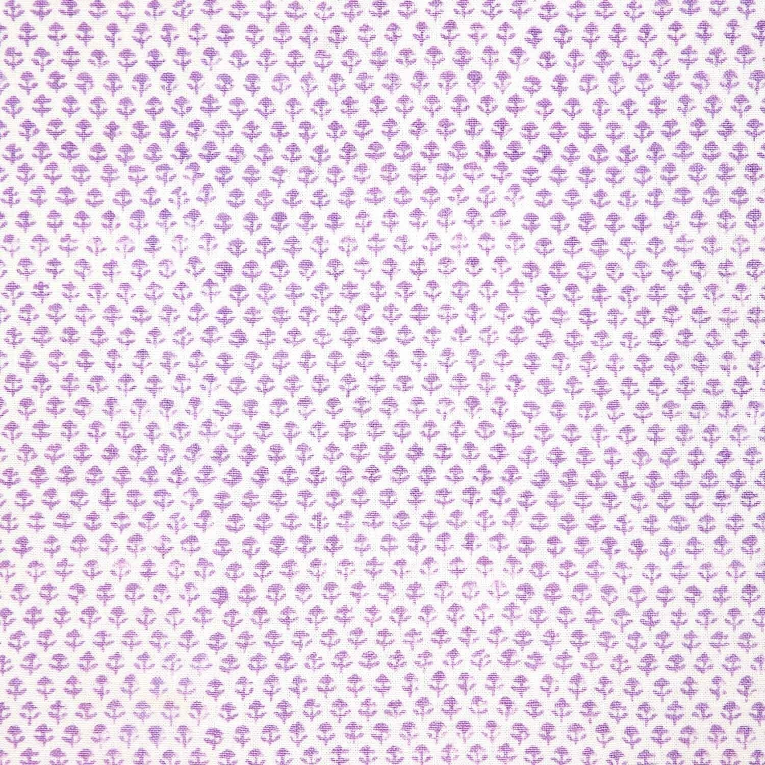 A Bindi Lavender Fabric with a purple and white polka dot pattern on a white background featuring traditional craftsmanship by John Robshaw.