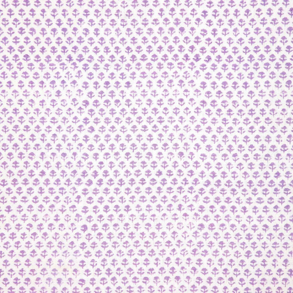 A Bindi Lavender Fabric with a purple and white polka dot pattern on a white background featuring traditional craftsmanship by John Robshaw.