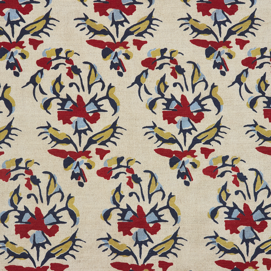 A Vijani Teak Fabric by John Robshaw, hand block printed with traditional craftsmanship, featuring beige color and vibrant designs in red, blue, and yellow.