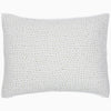 A white Organic Hand Stitched Moss Quilt pillow with hand stitched green dots on organic cotton voile by John Robshaw.