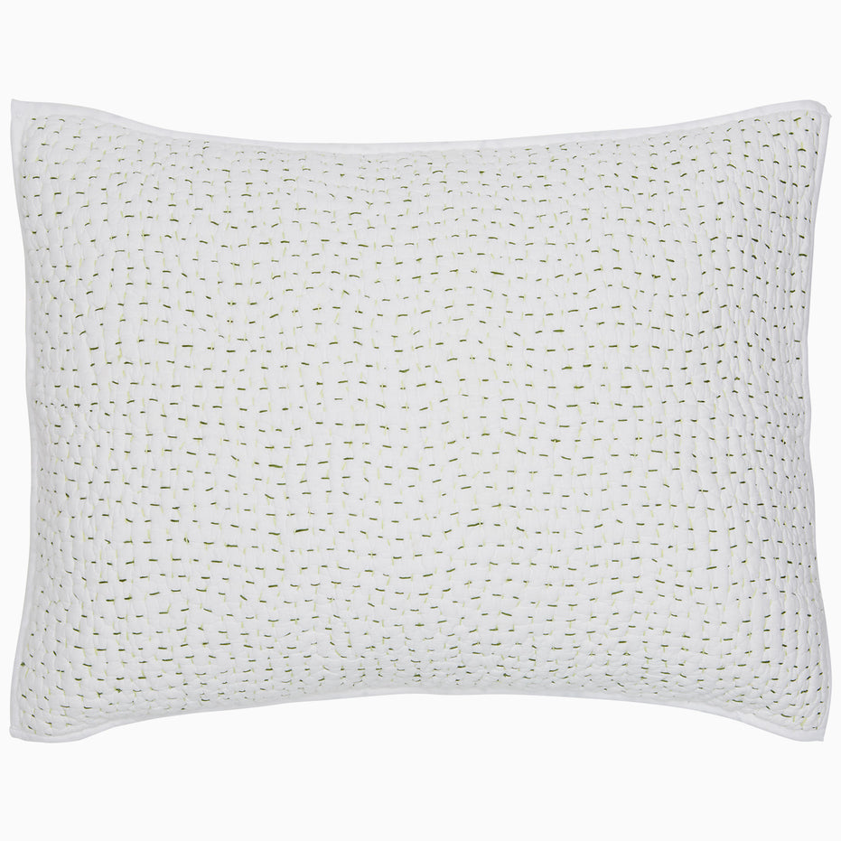 A white Organic Hand Stitched Moss Quilt pillow with hand stitched green dots on organic cotton voile by John Robshaw.